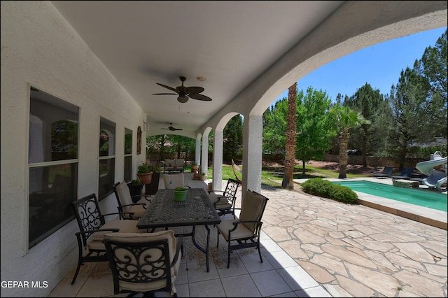 4490 Shadow Willow Dr, El Paso, TX 79922 - view of patio / terrace with ceiling fan, outdoor dining space, and an outdoor pool