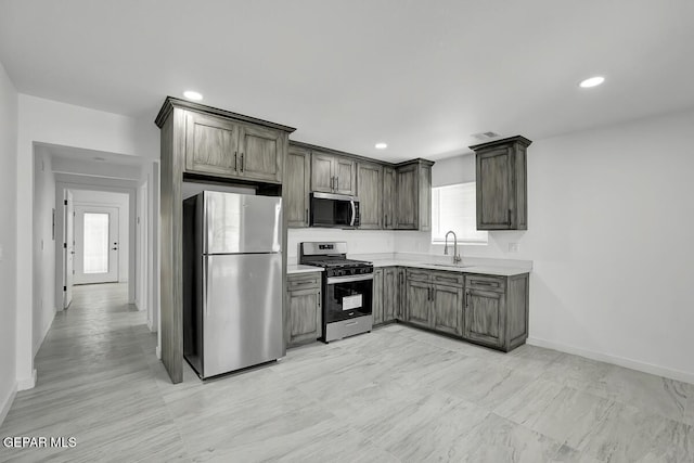 1107 Myrtle Ave A-D, Unit A-D, El Paso, TX 79901 - kitchen featuring stainless steel appliances, a sink, light countertops, baseboards, and recessed lighting