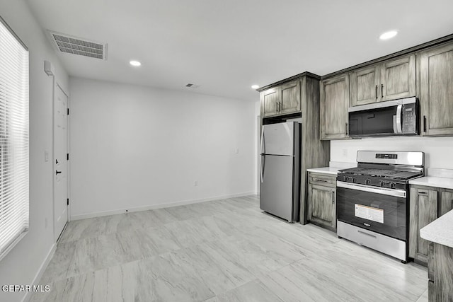 1107 Myrtle Ave A-D, Unit A-D, El Paso, TX 79901 - kitchen featuring appliances with stainless steel finishes, light countertops, baseboards, and recessed lighting