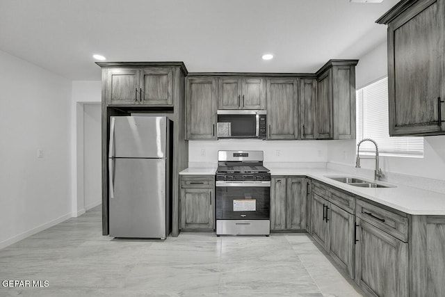1107 Myrtle Ave A-D, Unit A-D, El Paso, TX 79901 - kitchen featuring stainless steel appliances, a sink, light countertops, and recessed lighting