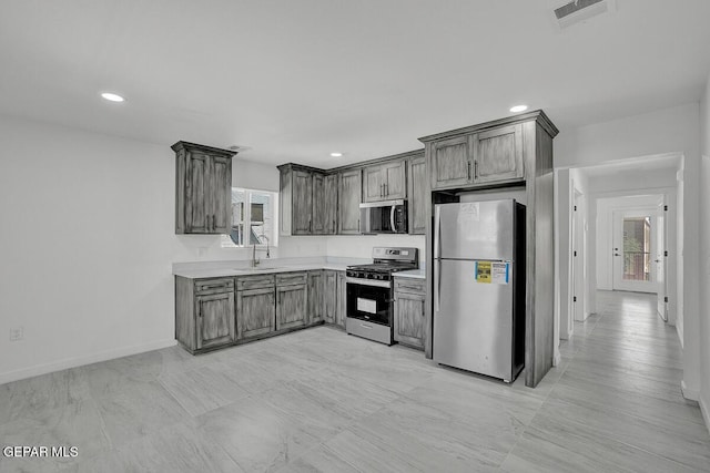 1107 Myrtle Ave A-D, Unit A-D, El Paso, TX 79901 - kitchen with appliances with stainless steel finishes, a sink, healthy amount of natural light, baseboards, and recessed lighting