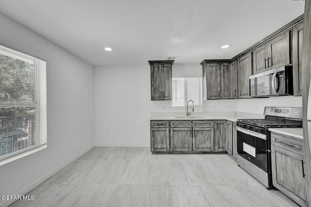 1107 Myrtle Ave A-D, Unit A-D, El Paso, TX 79901 - kitchen with appliances with stainless steel finishes, plenty of natural light, a sink, light countertops, and recessed lighting