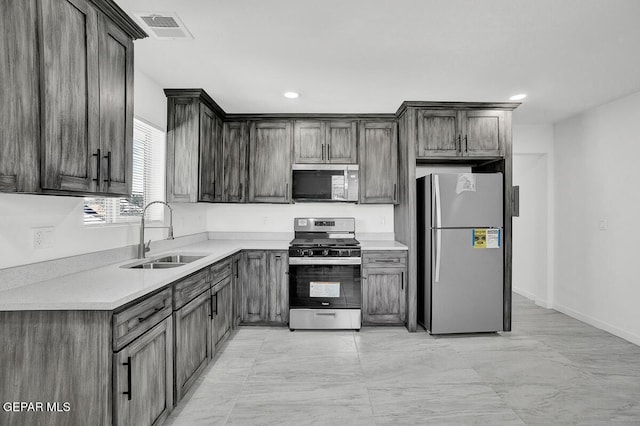 1107 Myrtle Ave A-D, Unit A-D, El Paso, TX 79901 - kitchen with appliances with stainless steel finishes, a sink, light countertops, recessed lighting, and light marble finish flooring