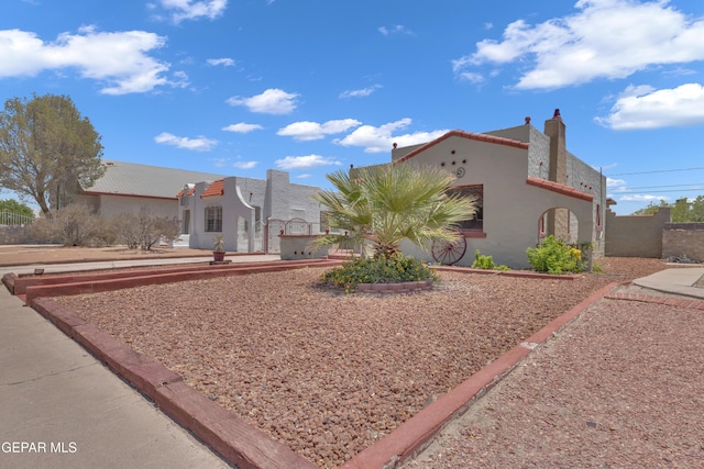 2312 Grant Ave, El Paso, TX 79930 - view of front of home with stucco siding and a gate