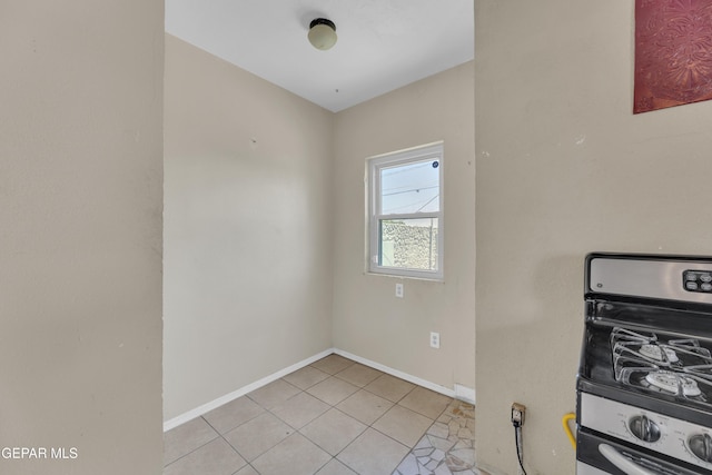 2312 Grant Ave, El Paso, TX 79930 - kitchen featuring baseboards and light tile patterned floors