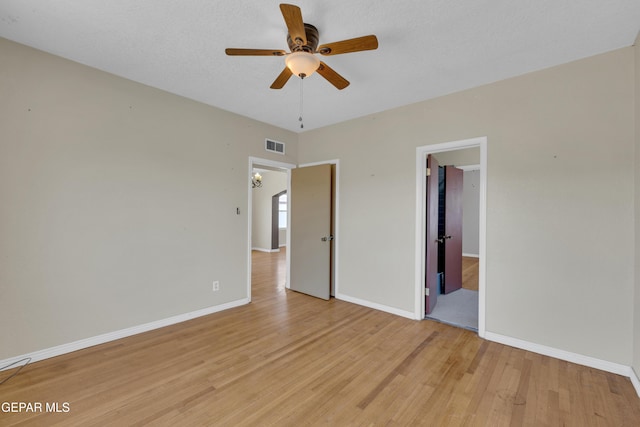 2312 Grant Ave, El Paso, TX 79930 - unfurnished bedroom with light wood-style flooring, baseboards, and ceiling fan