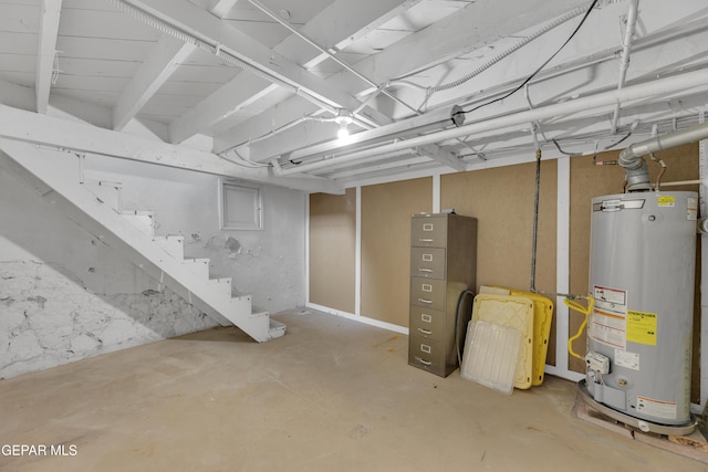 2312 Grant Ave, El Paso, TX 79930 - unfinished basement with gas water heater and stairway