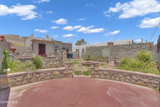 2312 Grant Ave, El Paso, TX 79930 - fenced backyard with a patio and an outdoor fire pit