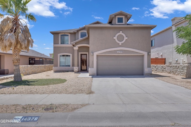 14378 N Cave Dr, El Paso, TX 79938 - mediterranean / spanish-style house featuring stucco siding, concrete driveway, and a garage