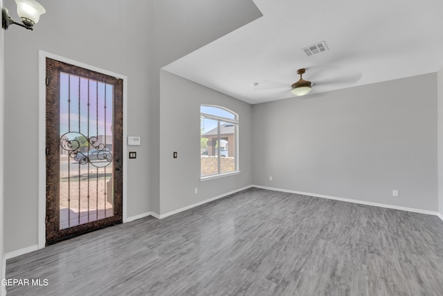 14378 N Cave Dr, El Paso, TX 79938 - foyer with wood finished floors, a ceiling fan, and baseboards