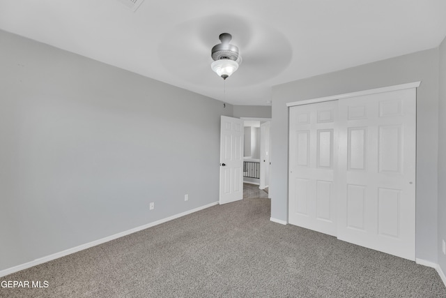 14378 N Cave Dr, El Paso, TX 79938 - unfurnished bedroom featuring carpet floors, a closet, baseboards, and a ceiling fan