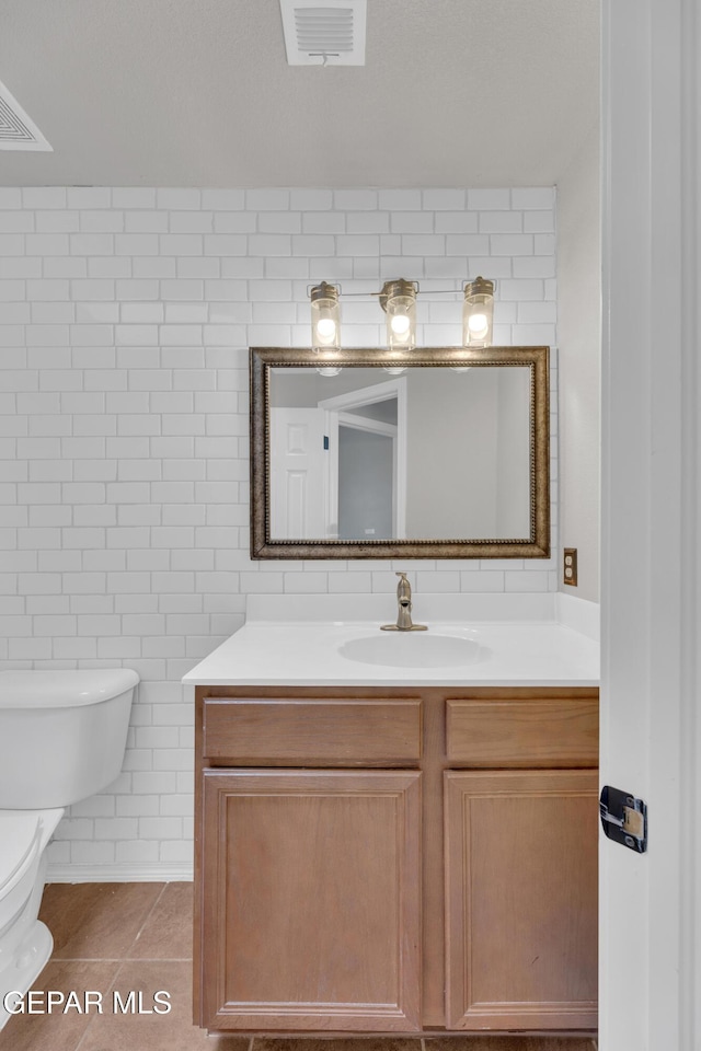 14378 N Cave Dr, El Paso, TX 79938 - bathroom featuring vanity, toilet, tile patterned flooring, and tile walls