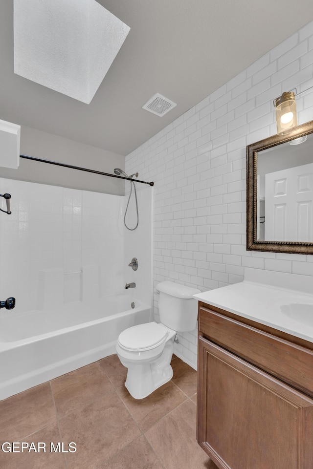 14378 N Cave Dr, El Paso, TX 79938 - bathroom featuring tile walls, toilet, vanity, shower / washtub combination, and tile patterned floors