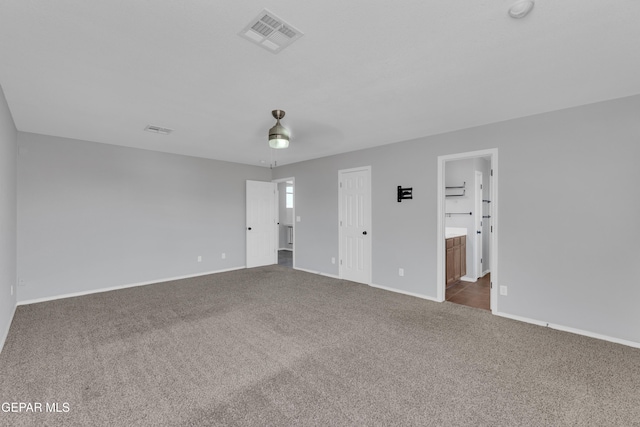 14378 N Cave Dr, El Paso, TX 79938 - unfurnished bedroom with carpet, baseboards, ensuite bath, and ceiling fan