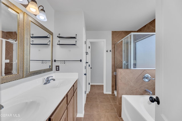 14378 N Cave Dr, El Paso, TX 79938 - bathroom featuring a stall shower, double vanity, a bath, and tile patterned flooring