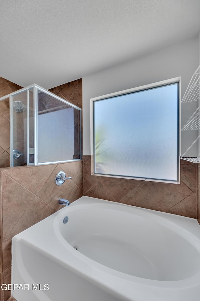 14378 N Cave Dr, El Paso, TX 79938 - full bath with a garden tub and a stall shower