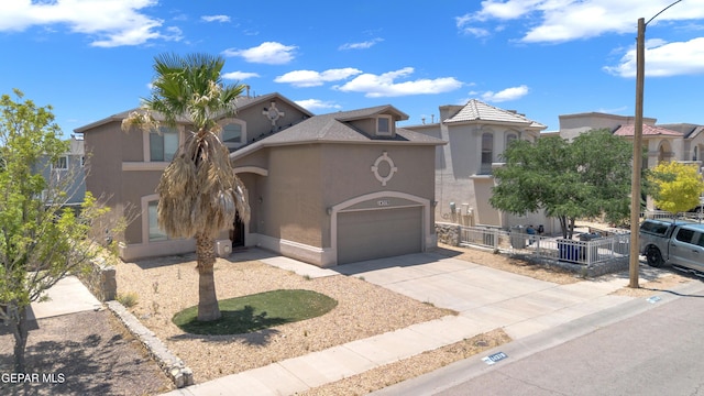 14378 N Cave Dr, El Paso, TX 79938 - mediterranean / spanish-style home featuring stucco siding, concrete driveway, an attached garage, and a residential view