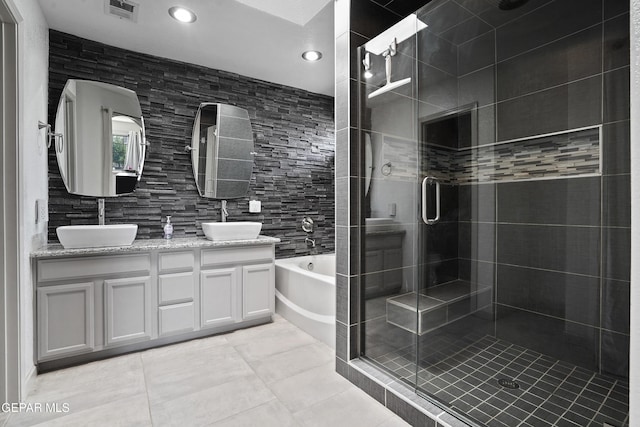 12800 Tierra Alexis Dr, El Paso, TX 79938 - bathroom featuring a stall shower, double vanity, a bath, recessed lighting, and tile patterned floors