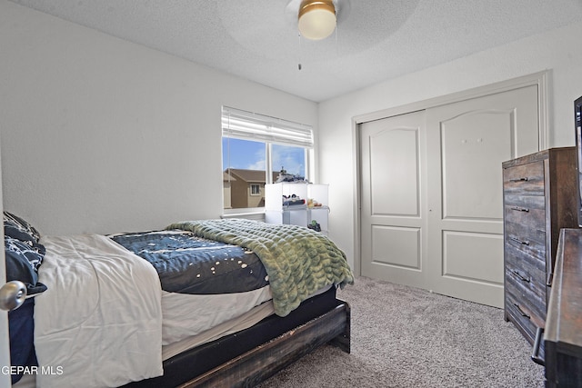 12800 Tierra Alexis Dr, El Paso, TX 79938 - carpeted bedroom with a closet, ceiling fan, and a textured ceiling