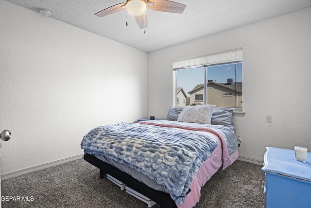 12800 Tierra Alexis Dr, El Paso, TX 79938 - carpeted bedroom featuring baseboards, a textured ceiling, and a ceiling fan