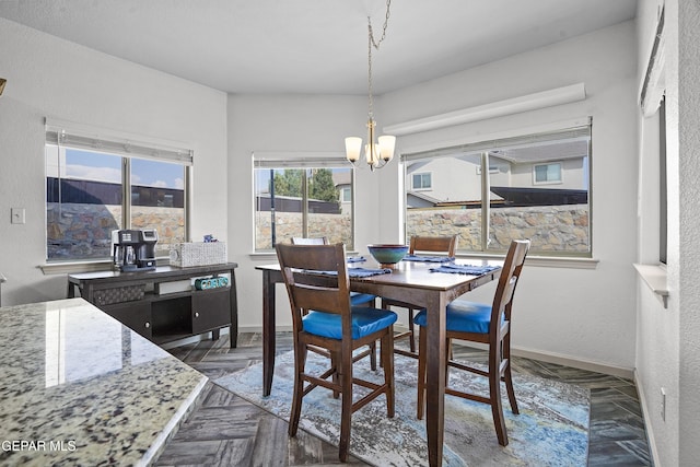 12800 Tierra Alexis Dr, El Paso, TX 79938 - dining area featuring a chandelier and baseboards