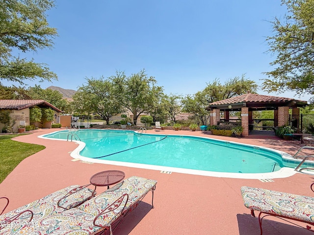 6006 Balcones Ct Unit 19, El Paso, TX 79912 - community pool featuring a gazebo, a patio, and a mountain view