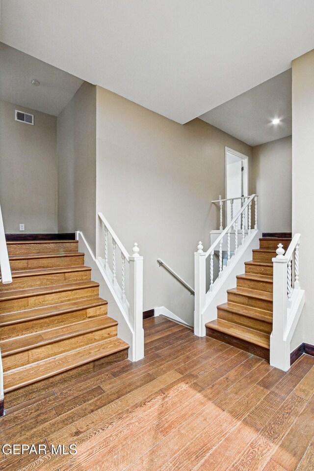 6006 Balcones Ct Unit 19, El Paso, TX 79912 - stairway featuring wood finished floors, recessed lighting, and baseboards