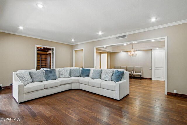 6006 Balcones Ct Unit 19, El Paso, TX 79912 - living room featuring dark wood-type flooring, ornamental molding, baseboards, recessed lighting, and a chandelier