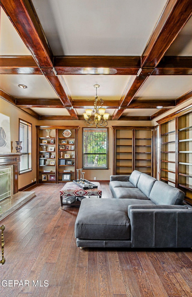 6006 Balcones Ct Unit 19, El Paso, TX 79912 - living area featuring coffered ceiling, a chandelier, beamed ceiling, hardwood / wood-style flooring, and a fireplace