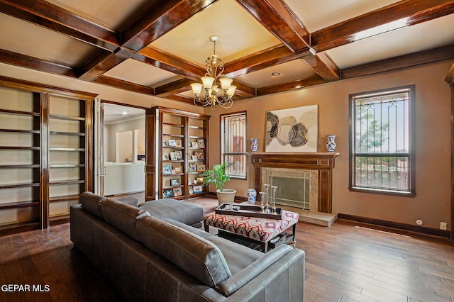 6006 Balcones Ct Unit 19, El Paso, TX 79912 - living room with a chandelier, baseboards, beamed ceiling, a premium fireplace, and dark wood-style floors