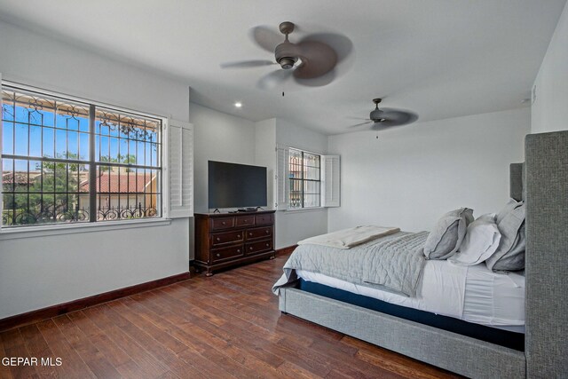 6006 Balcones Ct Unit 19, El Paso, TX 79912 - bedroom with dark wood-style floors, baseboards, and ceiling fan