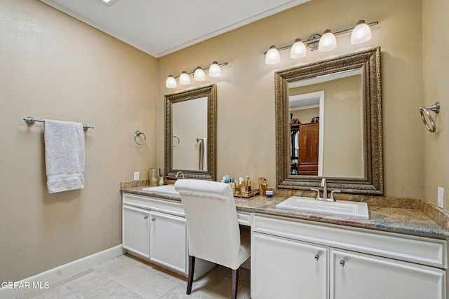 6006 Balcones Ct Unit 19, El Paso, TX 79912 - full bathroom featuring double vanity, baseboards, crown molding, and tile patterned floors