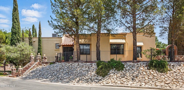 6006 Balcones Ct Unit 19, El Paso, TX 79912 - view of front of property featuring stucco siding and stairs
