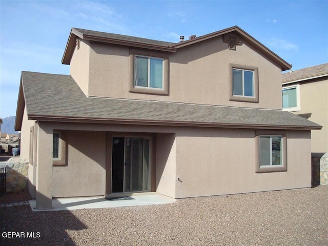 12036 Copper Hill Pl, El Paso, TX 79934 - back of house with stucco siding, roof with shingles, and a patio