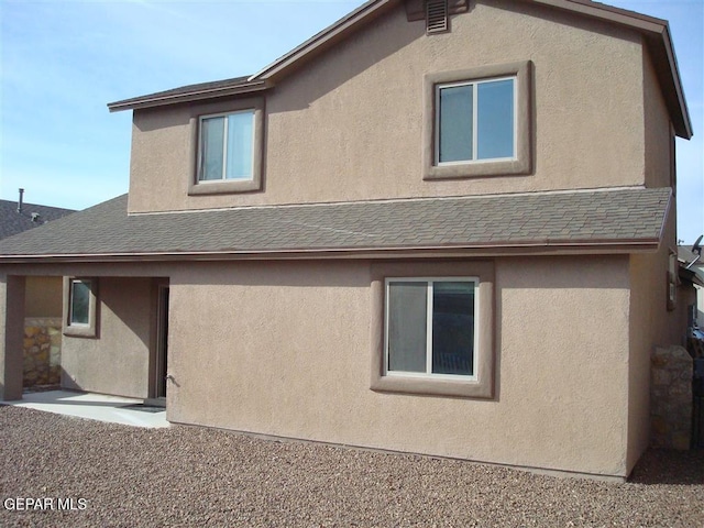 12036 Copper Hill Pl, El Paso, TX 79934 - rear view of property featuring stucco siding and a shingled roof