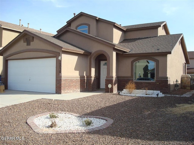 12036 Copper Hill Pl, El Paso, TX 79934 - view of front of house featuring stucco siding, concrete driveway, an attached garage, brick siding, and a shingled roof