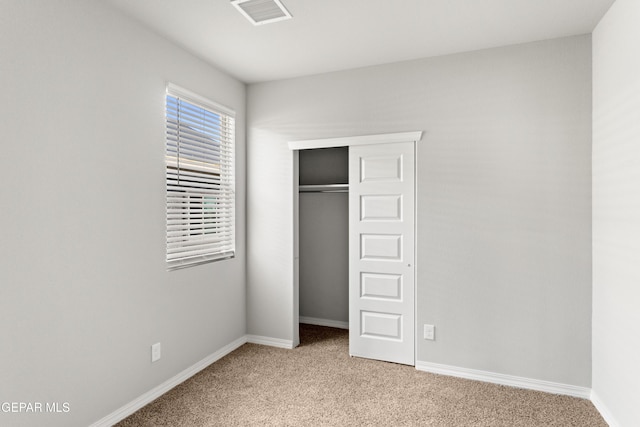 13905 Summer Hail Ave, Horizon City, TX 79928 - unfurnished bedroom featuring light colored carpet, a closet, and baseboards