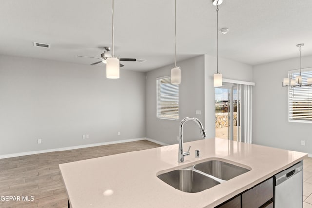 13905 Summer Hail Ave, Horizon City, TX 79928 - kitchen featuring a sink, stainless steel dishwasher, open floor plan, hanging light fixtures, and a chandelier