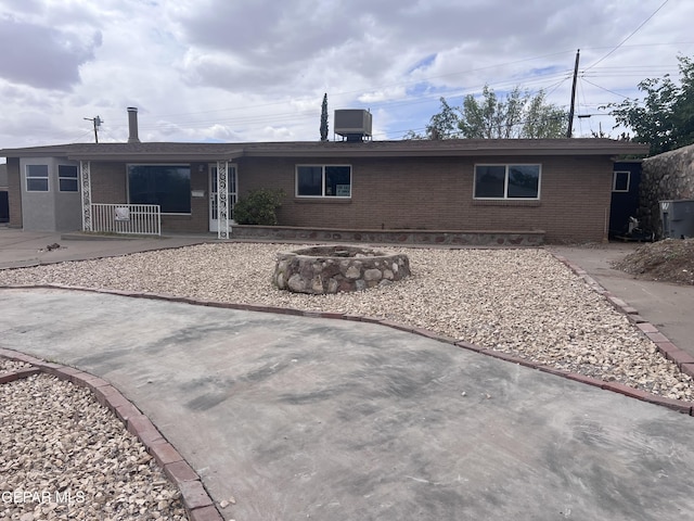 318 Olivia Cir, El Paso, TX 79912 - back of house featuring brick siding, covered porch, and a patio