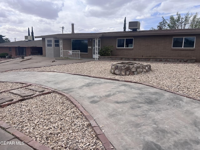 318 Olivia Cir, El Paso, TX 79912 - rear view of house featuring brick siding and a porch