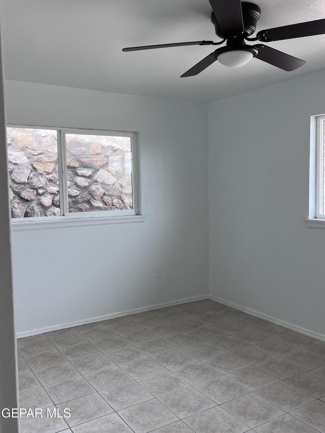 318 Olivia Cir, El Paso, TX 79912 - spare room featuring a ceiling fan, light tile patterned floors, and baseboards