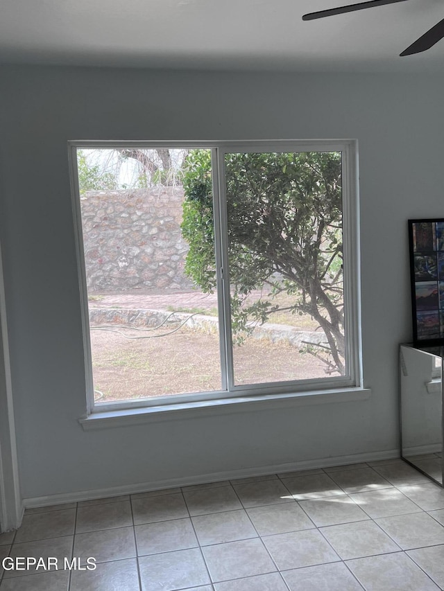318 Olivia Cir, El Paso, TX 79912 - unfurnished dining area with a ceiling fan, healthy amount of natural light, and tile patterned flooring