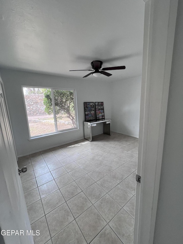 318 Olivia Cir, El Paso, TX 79912 - unfurnished living room with light tile patterned floors and ceiling fan