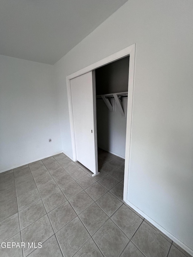 318 Olivia Cir, El Paso, TX 79912 - unfurnished bedroom featuring tile patterned floors and a closet