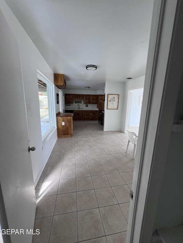 318 Olivia Cir, El Paso, TX 79912 - corridor featuring light tile patterned flooring and a sink