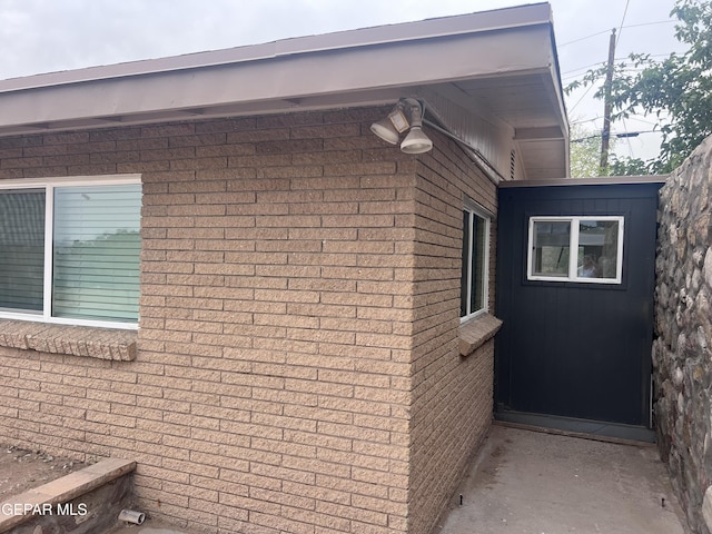 318 Olivia Cir, El Paso, TX 79912 - view of side of property featuring brick siding