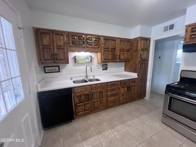 318 Olivia Cir, El Paso, TX 79912 - kitchen featuring stainless steel range, black dishwasher, a sink, and light countertops
