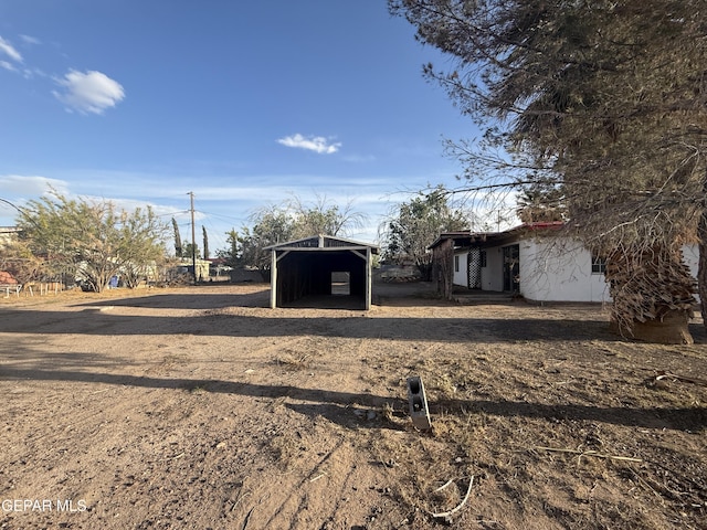 10385 Potencia Dr, Socorro, TX 79927 - view of yard with an outbuilding and a pole building