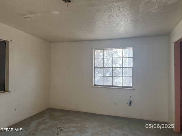 10385 Potencia Dr, Socorro, TX 79927 - empty room with carpet and a textured ceiling