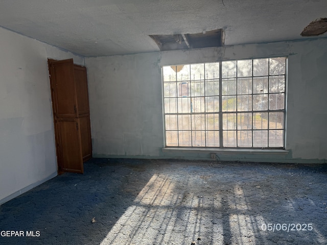 10385 Potencia Dr, Socorro, TX 79927 - carpeted empty room featuring a textured ceiling